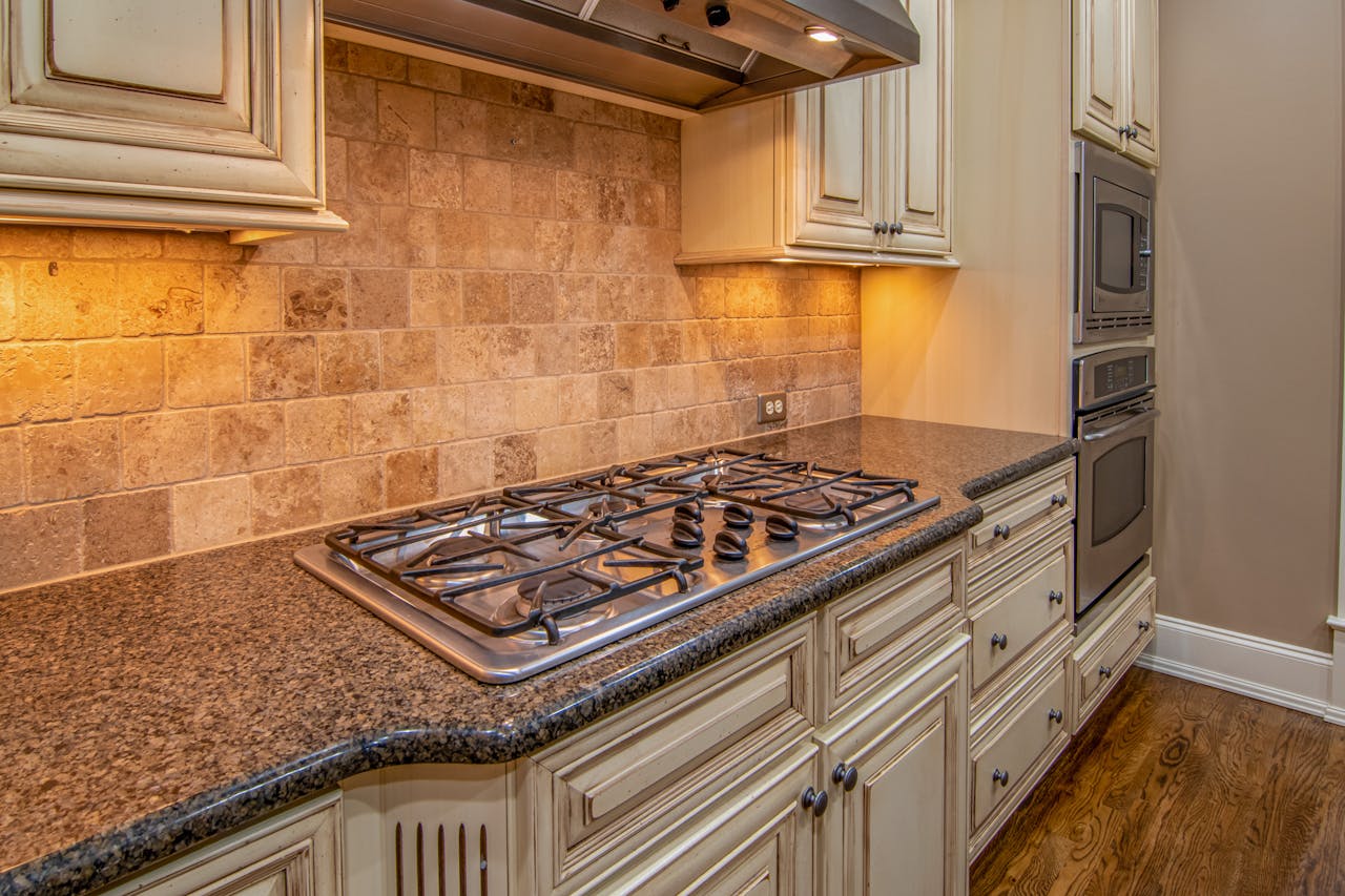 Elegant kitchen featuring granite countertops and stainless steel appliances.