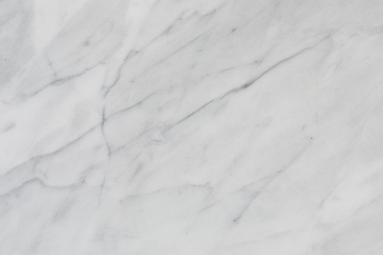 Elegant marble texture with subtle veins, perfect for backgrounds or design purposes.
